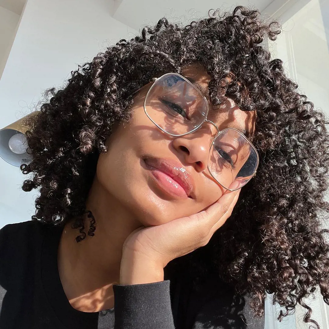 Yara Shahidi rocks a wash and go hairstyle with her natural curly hair