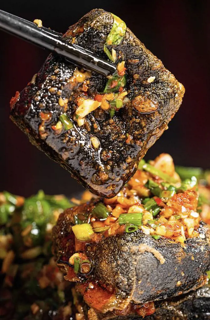 Stinky Tofu created with fermented bean curd is known for its strong scent available at roadside stands in China