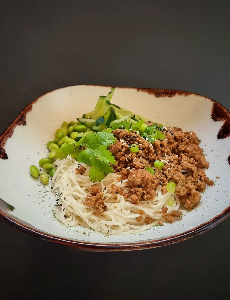 Zhajiangmian is a Chinese dish which also known as noodles served with fried beans sauce consist wheat noodles topped with tasty soybean-based sauce